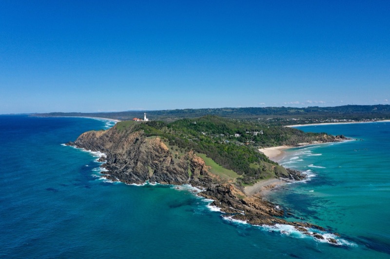 Cape Byron lighthouse and coastline with the green hinterland beyond, New South Wales
