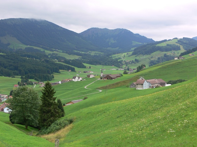 Green rolling hills and farmhouses of the Appenzell countryside, Switzerland