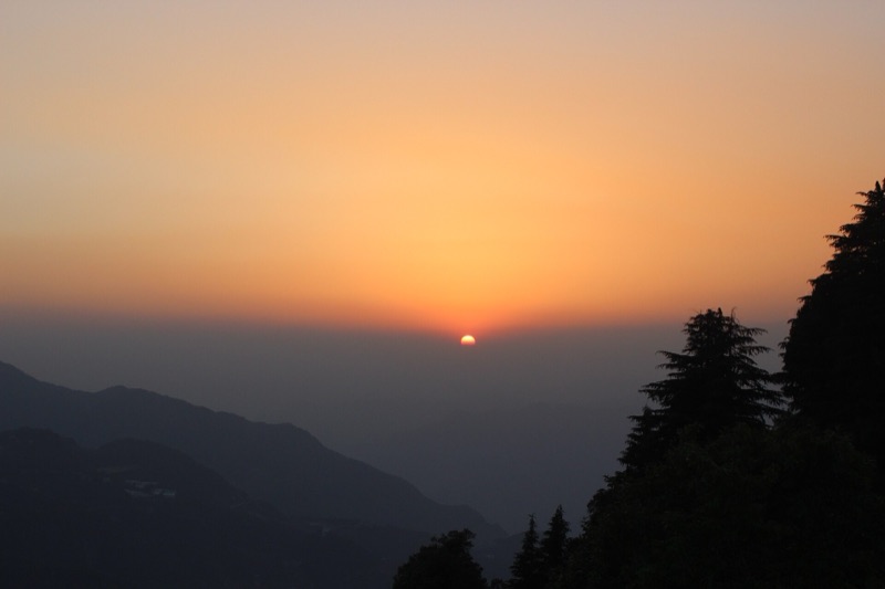 Sunset over the forested hills of Mussoorie above Dehradun, Uttarakhand