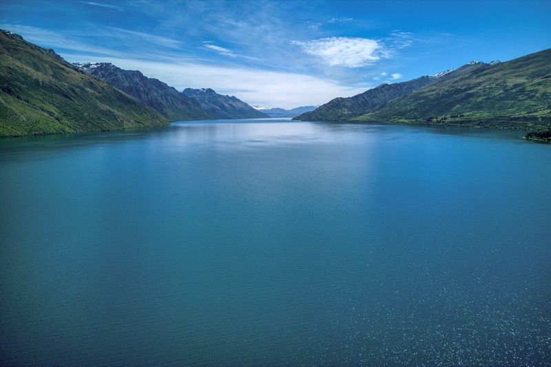 Lake Wakatipu between green mountains near Queenstown, New Zealand