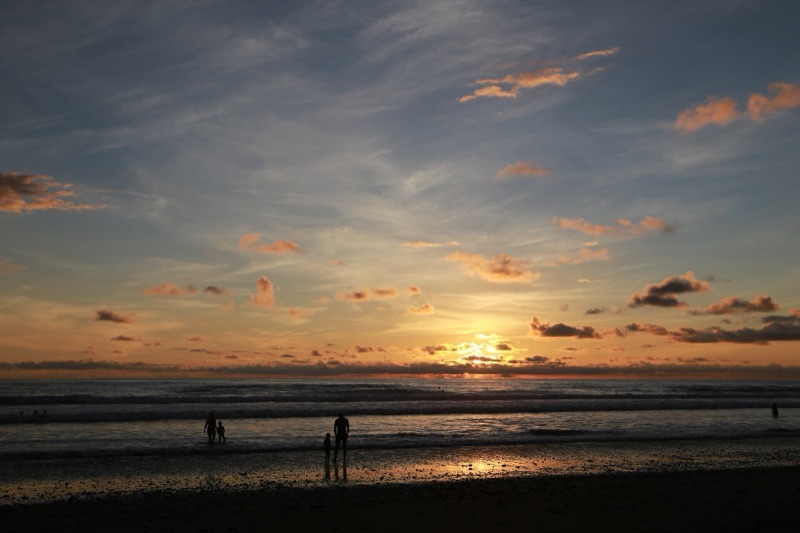 Sunset over the surf at Playa Hermosa on Costa Rica's Pacific coast